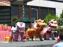 The very good lion dance.  When watching this, notice how the lions can
go to double height by having the person in front stand on the person in
back.  In fact, later in the dance (not in the video), the middle lion
does this trick again on top of the hobbyhorse.  That takes some skill. 
Also notice that the lion's eye can wink.  (The middle lion winks 28
seconds into this video.)  I didn't notice it in person; I only noticed
when I watched the recording a few times.
