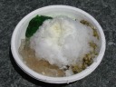 Shaved ice.  I got to select three toppings: green jelly, pale jelly,
and sorghum (or is it barley?).  The dish and the topping options reminded
me of Singapore.


