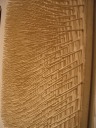 An unusual view of a board of angled nails.  (The traditional view is
straight-on; I took this picture with the camera against the wall.)
