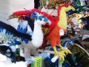 Two phoenix stuffed animals from the same booth.
