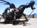 A fire-breathing dragon made from scrap metal parts.
