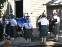 A Scottish (?) piping band.  It's interesting that the way they stood implied
they were playing for their own pleasure, not for any other festival
attendees.
