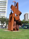 A funky statue that makes me think of a music clef.
