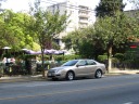 Probably the nicest Macaroni Grill anywhere.   If you view the full
sized image, you can see the Macaroni Grill sign and many outdoor tables
deposited in the garden-like setting.
