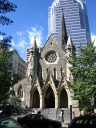 Christ Church Cathedral, a nice gothic cathedral on the predominately retail 
street rue St-Catherine.  According to my Fodor's guide book, "In 1988 
the diocese assured the stability of both its soil and its finances by 
leasing its land and air rights to developers, who then built ... a 
34-story office tower behind the cathedral and a huge retail complex ... 
below it."
