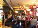 The lively interior of Olive y Gourmando.  I love the lamps.
