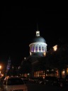 The lit dome of Marche Bonsecours on the right; the steeple of Chapelle 
Notre-Dame-de-Bon-Secours on the left in the distance.
