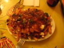 Vegetable poutine: french fries, gravy, cheese curds, green peppers,
onions, and mushrooms.
