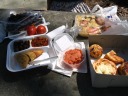 We bought lots of food from the Dekalb market for our picnic.  From the 
left-to-right, top-to-bottom we got: grapes, tomatoes, tomato-and-onion 
focaccia, marinated mushrooms, lamb chile, lamb samosa, smoked fish, 
chocolate macaroon, cheese danish, ham-and-cheese croissant, and a slice 
of tiramisu.  Obviously, we had leftovers and used them for breakfast the 
next day. 
