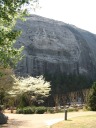 The bas relief of Stonewall Jackson, Jefferson David, and Robert E. Lee for 
which Stone Mountain Park is famous. It's the largest bas relief 
sculpture in the world.  It was created by the same person who would 
later carve Mountain Rushmore.  If you read the relief's history, 
it's a classic example of the funding troubles many large projects go 
through.  This one, after multiple stops and starts, took about fifty 
years to complete. 

Also, Stone Mountain is the largest piece of exposed granite in the
world.  Sadly, this is my only picture of it and it doesn't capture its
sheer mass.  In fact, I didn't appreciate the sheer mass of it until
later, as we drove out of Stone Mountain Park and got a distant view
from which I could see the whole monolith.  The base's circumference is
more than five miles.  I'm sorry I didn't take a picture of it from this
distant vantage point.
