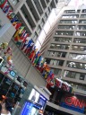 Yet another set of flags.  This set hangs in the CNN Center.  Of all the
flags we spotted today, this location made the most sense.  This
picture also shows how the CNN Center is composed of pre-existing buildings
that were then covered and glassed in. 

The tour guide told us the building previously was an amusement park
with a human pinball game (yes, you sat in a giant ball) an ice
skating rink, and more.
