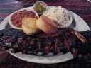 Baby back ribs, biscuits, beans, coleslaw, and pickles (!).
