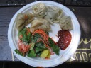 Lunch: meat momos, veggie momos, salad, and chile sauce.
