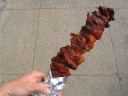The skewer of chicken I brought from the booth with the previously
photographed huge grill.  It's even larger than it looks because some
meat is hidden under the aluminum foil.
