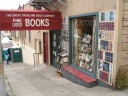 A pretty good used bookstore where I relaxed and browsed for half an
hour.  I love the mural surrounding the window!
