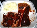 Dinner from Cowboy's Barbeque & Rib Company: pork ribs, beef brisket,
beans, and potato salad.
