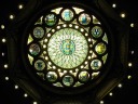 The stained glass dome above the stately lobby displays the seals of the
thirteen original colonies.

