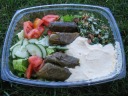 I wanted a cool lunch and so bought a box with (slightly dressed) salad,
(vegetarian) dolmas, tabbouleh, and hummus.
