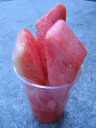 Watermelon, my mid-afternoon snack, partially photographed for a friend. 
I carried it for a while before finishing it.  (I think it lasted until
I crossed the bridge to Charleston.)
