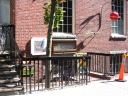 Veggie Planet, our dinner location, is a basement restaurant.  Given the
sunken entrance and the atmosphere, I'd normally call it a hole in the
wall except that it has a web page. While we were there, one room had
diners listening to a live musical performance.  This picture was
taken the following day after I realized I forgot to take a picture of
the entrance.
