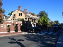 Harvard has walls and gates.  Some gates get closed at night. As there
are many gates and they are more ornamental than substantial, they're
not as defensive as Columbia's, but they at least reminded me of
Columbia.


The yellow building in this picture is Wadsworth House, built in 1726.
