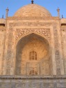 One side of the Taj as seen from the building in the previous picture.
 Look at the full-sized image to see all the Koranic writings
engraved around the arch.  As the sun rose, the Taj Mahal really
did appear to glow; our advice to come at dawn was correct.
