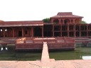 Opposite the Diwan-i-Khas, across the large courtyard, is Anoop
Talao, a four-quartered pool, echoing, in some sense, the same style of
design. 
Farther away, yet more columns are visible.
