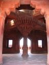 Inside the Diwan-i-Khas.  Debates are said to have happened on the
second floor where the bridges come together.  Look at the intricate
column supporting the central platform.
