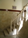 The stately marble staircase that leads up to our room.

