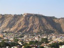One of the forts overlooking Jaipur, as seen from the top of the minaret.
