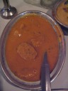 Bela rajasthani: "spicy and steamed thick gram
flour dumplings with spices in a Jaipur gravy."  Spicy.


