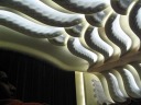 Part of the curtained movie screen along with the ceiling, frozen in its
undulations.
