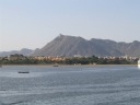 The old buildings on one part of the lake that I attempted to photograph
the previous
night.  High in the background is Sajjan Garh (Monsoon Palace).
