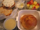 Lunch of a toasted bagel with chive cream cheese, fresh fruit, and a
potato knish served with chicken gravy.  All were perfectly pleasing; I
have no complaints, and that's saying a lot.  The knish dough was
lighter than I expected, but that's not bad, just different.  Also, I'd
never seen chicken gravy with knishes before.  Nonetheless, it seemed to
work.
