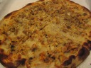 The white clam pizza (clams, garlic, white sauce, no cheese), one of Frank
Pepe's classics.  Like the other pizza we ordered, it was fairly greasy,
but not really in a bad way.  It also had nice blackened splotches on the
crust.  The slices had enough integrity to be eaten by hand.  
Overall, I thought the two pizzas we ordered were perfectly respectable.  
This particular pizza, with its chewy clams, I thought was decent; my 
parents thought it was okay or didn't like it much.

I had leftovers several days later; it didn't reheat well.
