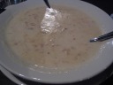 Clam chowder: very good; the best dish of the night.  There was no
filler (e.g., potatoes) in the soup, as fact made obvious as we finished
the bowl and saw tons of clams and such near the bottom of the bowl. 
The chowder was cooked with bacon, though we didn't find many bacon
pieces in the chowder itself.
