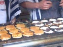 Imagawa yaki being made.  They're disc-shaped pancakes with red bean 
paste inside.
