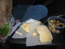 Part of our picnic dinner: celery, a sample of blue cheese, 5-year-aged
cheddar from Quebec (good; simultaneously sharp and creamy), ciabatta
roll, and olives.  The cheeses came from Hilary's Cheese; the bread came from True Grain Bread.  The olive
container holds jalapeno-stuffed olives, garlic-stuffed olives, dark
olives, and a button mushroom salad.


