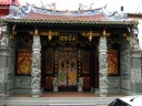 The Eng Choon Association.  Look at the intricate carved dragons (on the
pillars and in relief on the building's walls) and the crisp painted
door.  I note, amused, that this is picture number 888,
appropriate for something Chinese.
