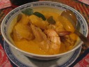 Udang lemak nenas: prawns cooked in a spicy coconut cream broth, with
"Sarawakian pineapple."  The broth really is coconut cream,
mildly spicy.  (I think the otak otak was spicier.)  I can't help but
feel they toned down the dish.  It felt like an unexciting variation on
a Thai dish. 

Incidentally, peeling the prawns without a knife was a pain.  Eventually
I got the technique: split them along their spines.
