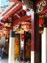 Along the side of the courtyard, decorative screens, painted lanterns,
and colored dougong.
