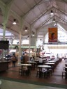 A panoramic movie taken from near the center of the octagonal Lau Pa Sat
Festival Pavilion, one of the oldest markets/hawker centers in
Singapore.  Though the kind of vendors the building has have changed
over time, the architectural design has remained roughly the same
through restorations; this video is intended to show the design.
