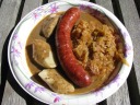 The combination plate: pirogis stuffed with mushrooms and sauerkraut, a 
kielbasa (Polish sausage), and bigosz (a Polish "hunters stew" of cabbage 
of meat, in this case chicken).
