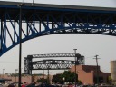 In the same vicinity, a lift bridge, framed by the Main Avenue Bridge.
