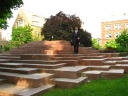 Dressed for the wedding, my friend Do plays on Q*bert-like steps. 
(We passed this walking to the church.)  Could be another Game clue?
