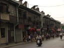 On one side of Tanggu Road: ramshackle buildings.
