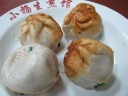 Yang's dumplings (sheng jian bao).  I watched them being made.  They were
first shallow-fried, then steamed.  This was my lunch.  (The
dumplings are much bigger than they appear in this picture.)

