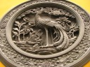 A peacock bas relief.  Excellent.

