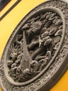 A bas relief of a dragon.

