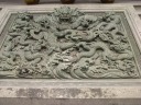 An intricate relief of a dragon.  Wow, what a tail!
